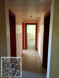 Two-bedroom apartment with a living room and two bathrooms opposite Nesto in Al Rashidiya Towers. An