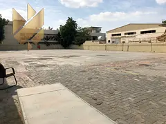 Yard in Industrial 15 with 16000 sqft on main road two offices security room and 51KW power rent AED