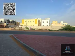 Land for sale Ajman Mowaihat 2 main road g+2