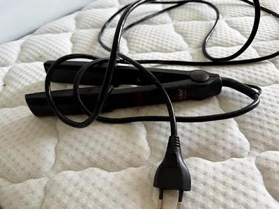 Ceramic hair straightener (flat iron) - used, works fine. European plug