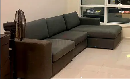 L-shaped grey fabric sectional sofa - used, good condition