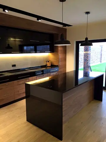 Modern kitchen island with black quartz countertops