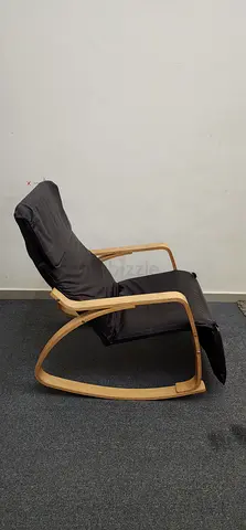 Wooden rocking lounge chair with black cushion