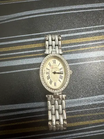 womens silver bracelet watch with crystal bezel, roman numerals