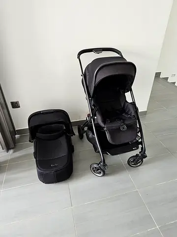 Black silver cross stroller and carrycot