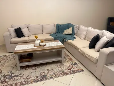 Comfortable L-shaped Sofa with Coffee Table and carpet