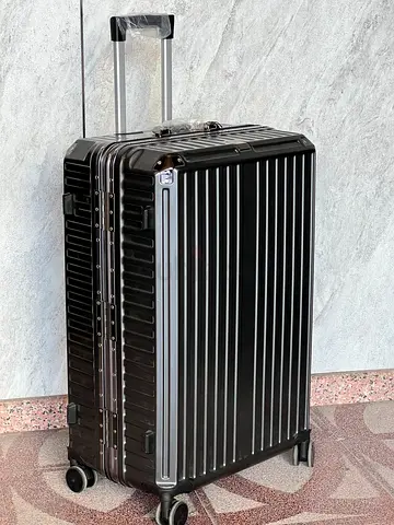 mid sized black premium suitcase
