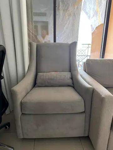 Rocking nursing light grey upholstered armchair with lumbar cushion - good condition