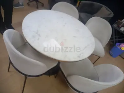 My round marble dining table with 4 upholstered chairs