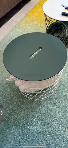 Stylish storage table with green gray cover