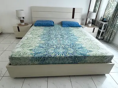 Light wood double bed set with mattress and 2 bedside tables and 4 door Cupboard