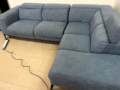 L-shaped corner sofa with electric recliner from United Furniture.