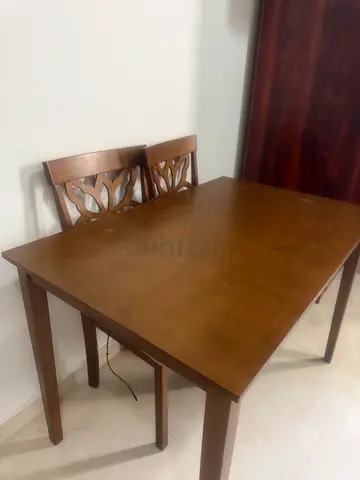 Solid wood dining table with 3 matching chairs - good condition