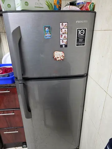 Selling my stainless steel double-door refrigerator (top freezer) — used, working well