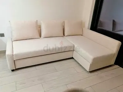 Beige L-shaped sofa with chaise — used, good condition