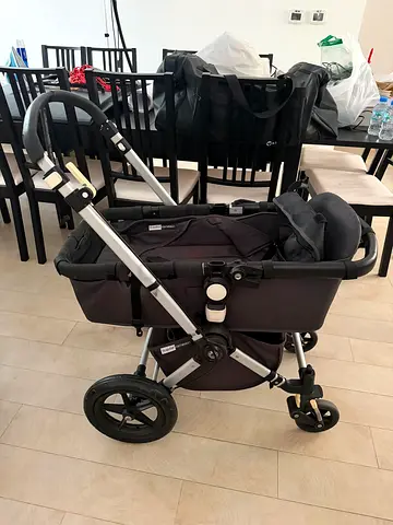My used pram stroller — good condition, sturdy frame with travel bag