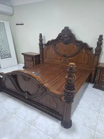 My carved solid wood bed with matching nightstands