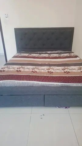 My grey upholstered double bed with storage drawers and tufted headboard with  new mattress