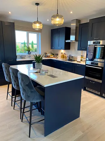 Modern navy kitchen island with quartz countertop