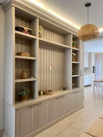 Light grey built-in entertainment center with shelves  cabinets