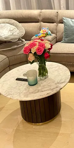 Round marble-top coffee table with wooden slatted base and TV unit set