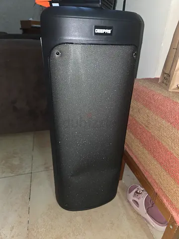 Black floor-standing tower speaker - used and working