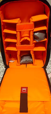 DSLR Padded camera backpack (orange interior) with customizable dividers brand new not used