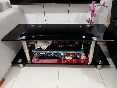 URGENT SALE: Black glass TV table