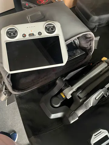 Drone with built-in-screen remote controller and carry case