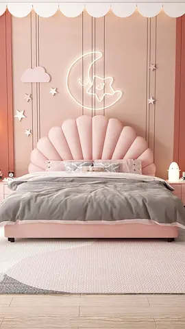 Pink shell-shaped childrens bed with upholstered headboard