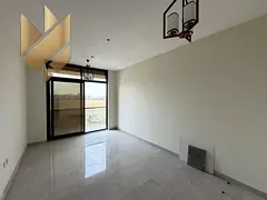 Muweilah Commercial – 1BR hall with balcony – first tenant new building – main road – 2 bath