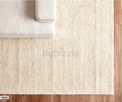 Beige textured area rug — gently used