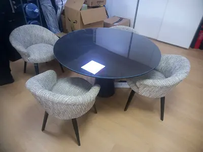 Round dining set — dark round table with 4 upholstered chairs