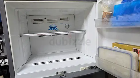 Top-freezer refrigerator — used, working, clean interior