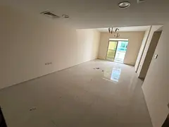 Apartment for annual rent in Ajman, two bedrooms, living room, two bathrooms, and a balcony. Located