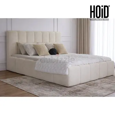 Cream upholstered platform bed with padded headboard