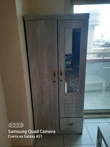 Grey wooden wardrobe/armoire with mirror and drawers