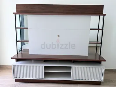 My modern TV entertainment unit with glass shelves and sliding doors