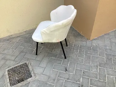 White scallop-back velvet accent chair with black leather