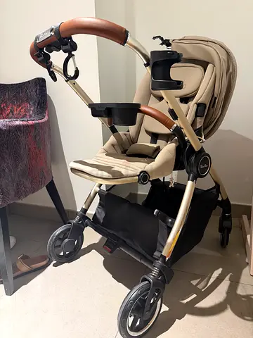 Beige full-size baby stroller in good condition