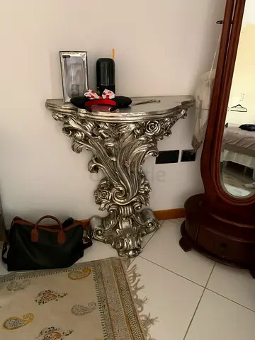 Ornate silver rococo-style console table