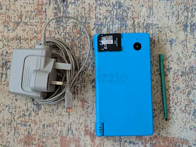 Modded Nintendo DSi (blue) with charger, stylus and SD card (play all games for free)