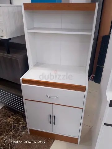 My white storage cabinet with open shelves, drawer and cupboard
