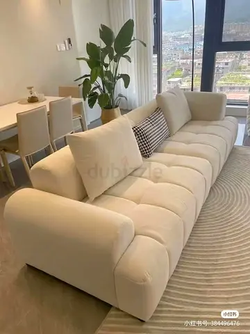 My cream 3-seater tufted sofa