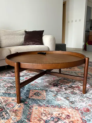 Round solid wood coffee table — mid-century style