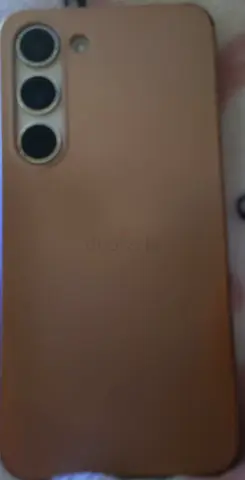 Phone with triple rear camera in brown protective case - excellent condition