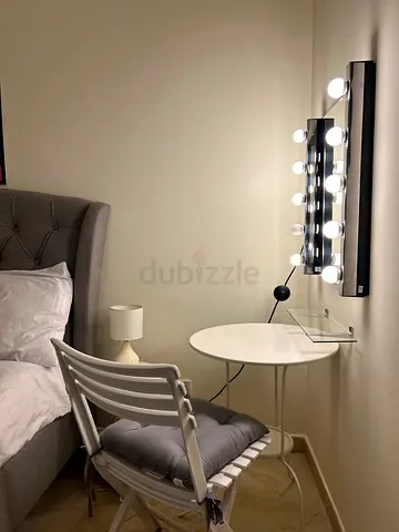 Wall-mounted Hollywood vanity mirror with bulbs