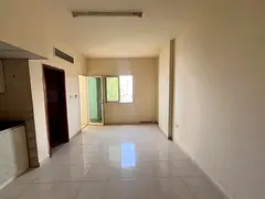 Studio apartment for annual rent in Al Rawda, Ajman. Features include a balcony, spacious area, stun