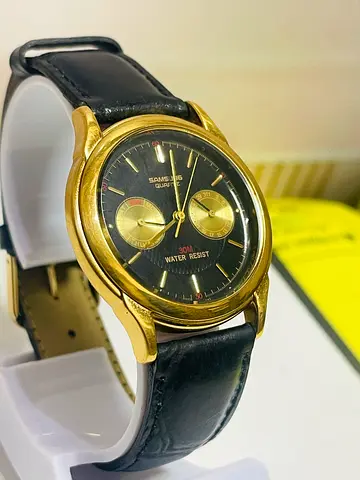 Mens sunsung gold-tone quartz watch with black dial and leather strap