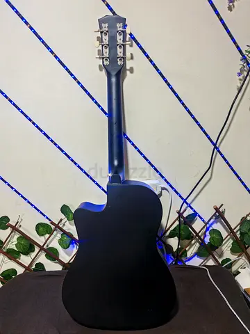 Black cutaway acoustic guitar - used, good condition